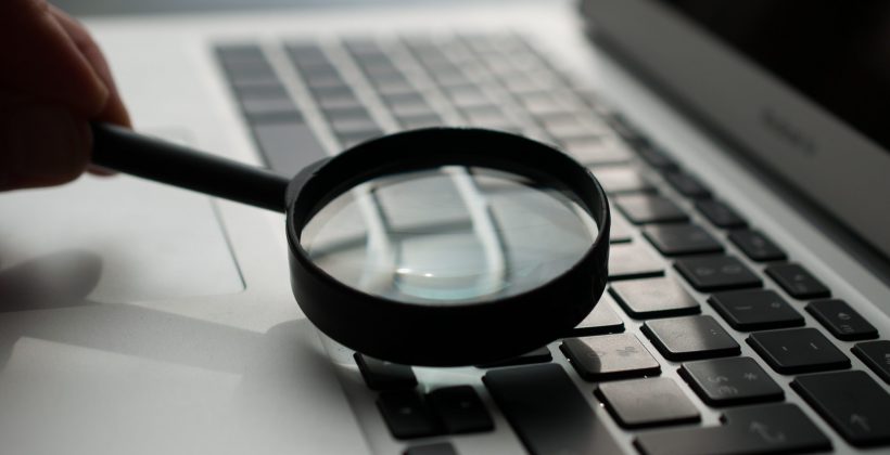 Magnifying glass over keyboard searchandising